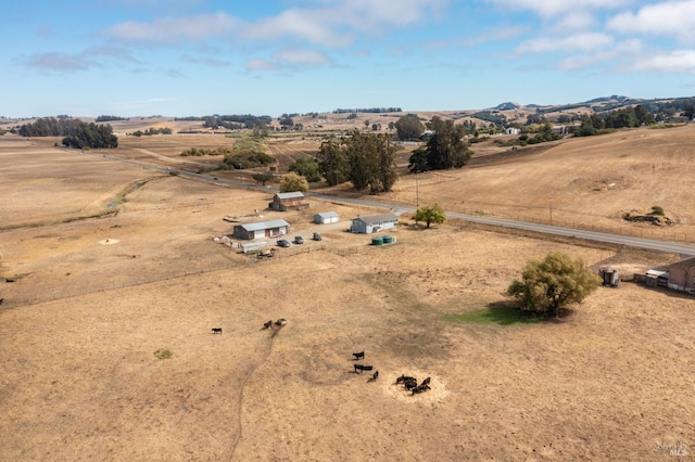 birds eye view of property with a rural view