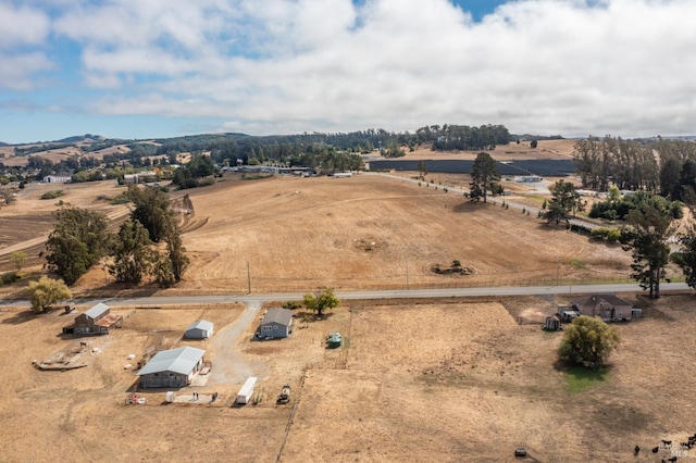 birds eye view of property with a rural view