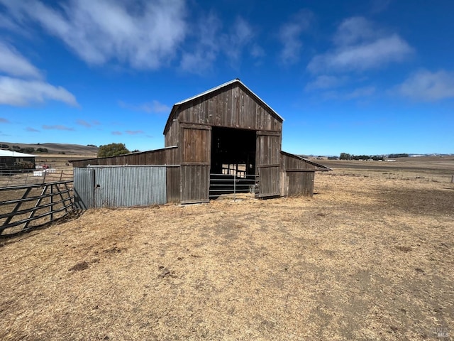 view of outbuilding with a rural view