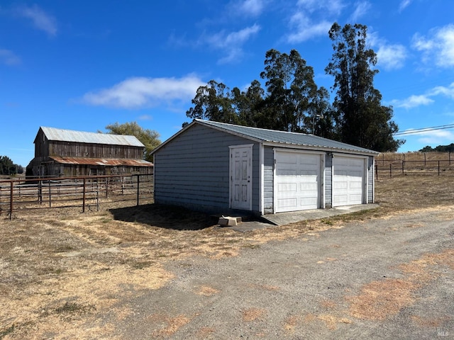 garage featuring a rural view