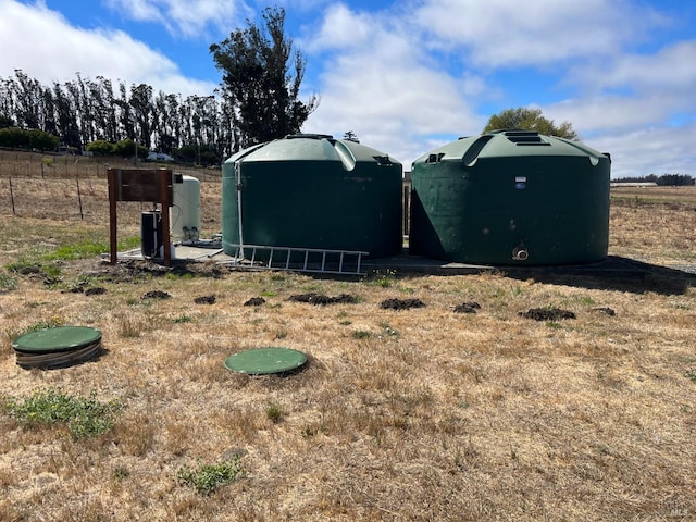 view of yard with a rural view