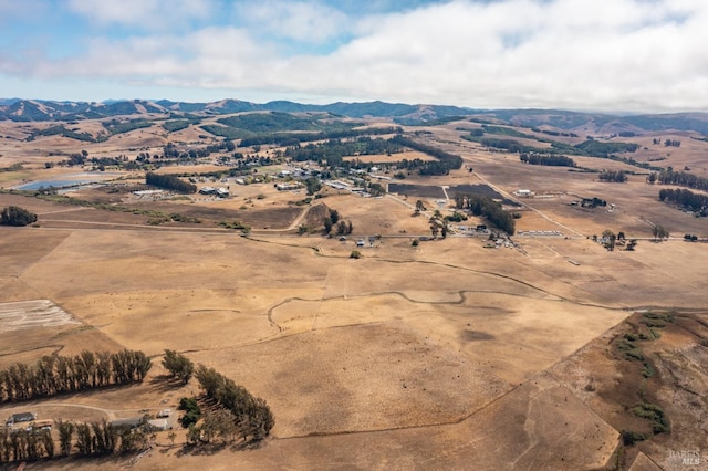 drone / aerial view featuring a mountain view