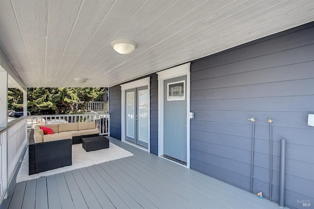 wooden terrace featuring outdoor lounge area