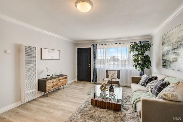 living room featuring ornamental molding and light hardwood / wood-style floors