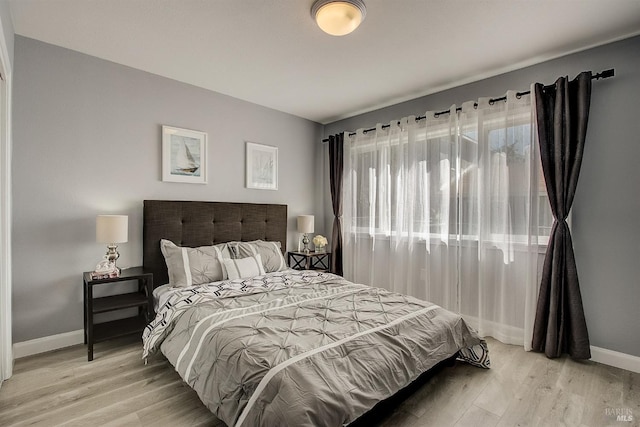 bedroom with light hardwood / wood-style floors