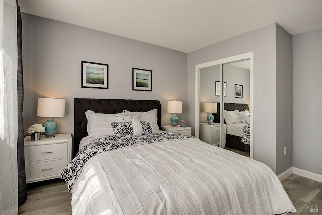 bedroom with hardwood / wood-style floors and a closet