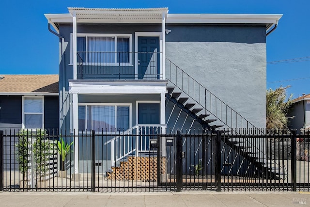 view of front of property with a balcony