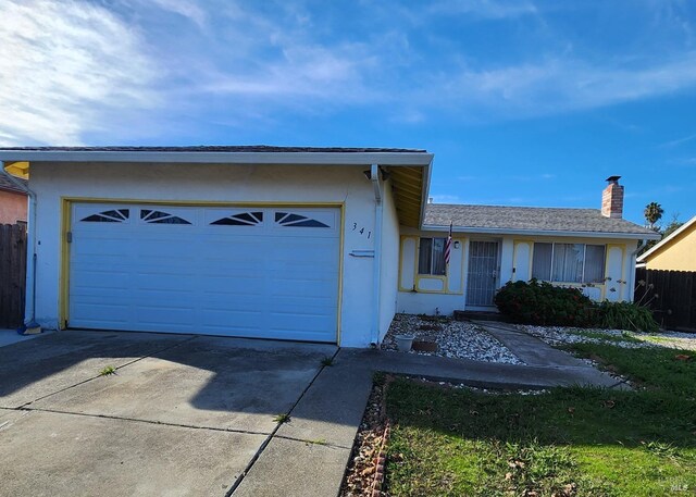 single story home with a garage