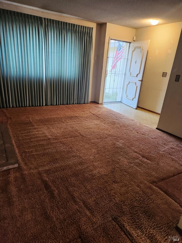 341 Inverness Dr, Vallejo, CA 94589 - empty room featuring light carpet and a textured ceiling