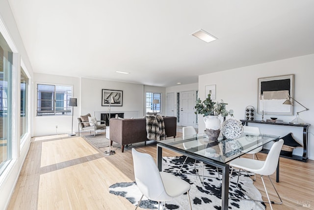 dining area featuring light wood-style flooring