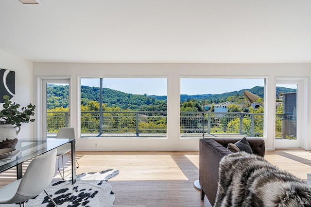 bedroom featuring baseboards and wood finished floors