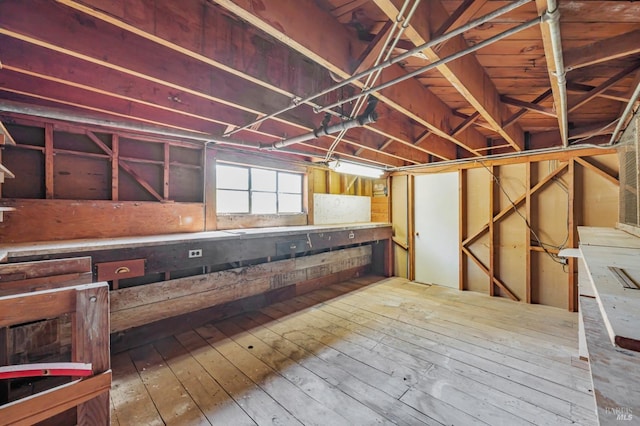 below grade area featuring hardwood / wood-style floors
