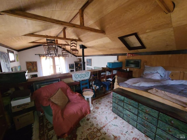 bedroom featuring lofted ceiling with beams