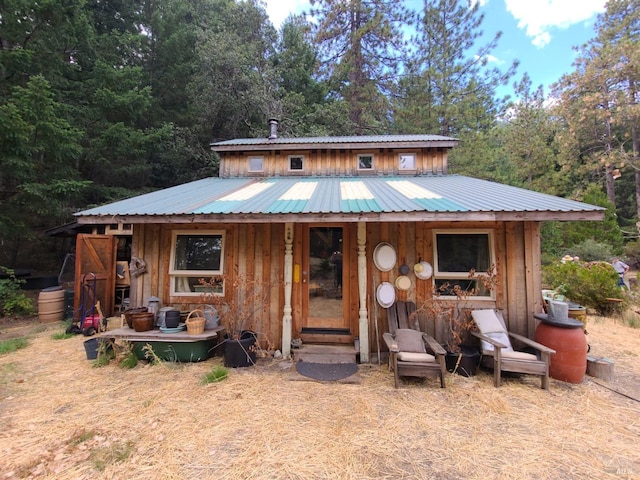 view of front of house with an outbuilding