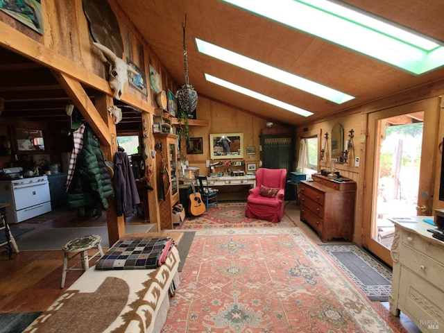 misc room with wood walls and vaulted ceiling