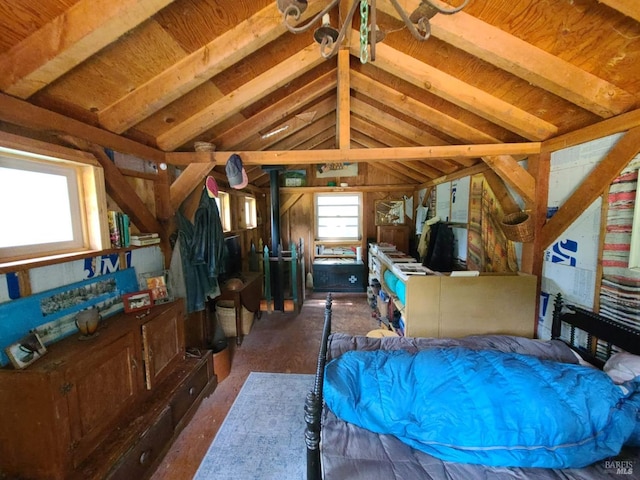 interior space featuring vaulted ceiling with beams and multiple windows