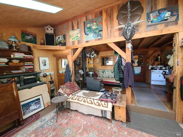 interior space featuring wooden walls and vaulted ceiling