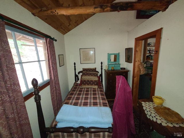 bedroom featuring vaulted ceiling with beams and wooden ceiling