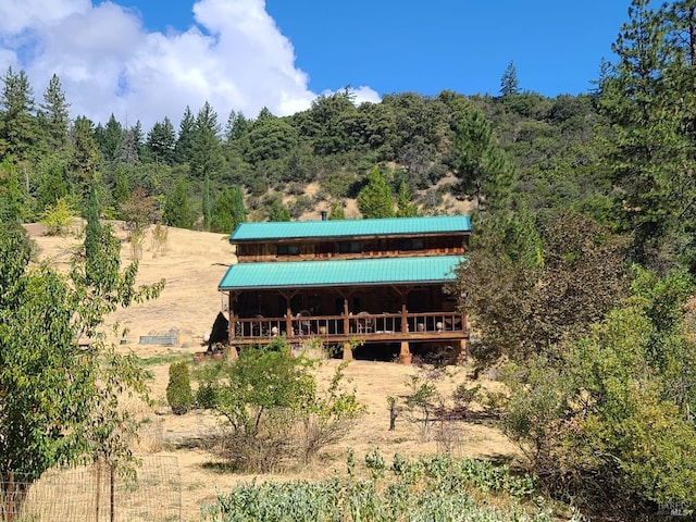 rear view of property with a rural view