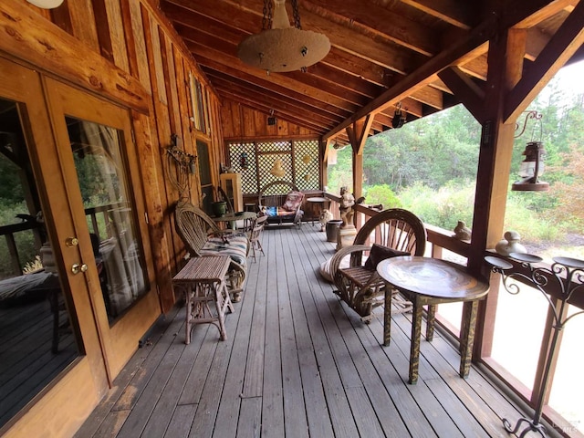 wooden terrace featuring ceiling fan