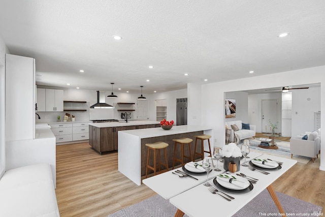 interior space featuring light hardwood / wood-style flooring and a textured ceiling