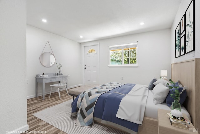 bedroom with hardwood / wood-style flooring