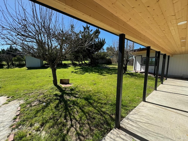 view of yard with a storage unit