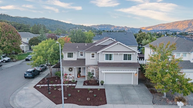 view of front of house with a mountain view and a garage