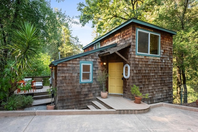 exterior space featuring a patio and a wooden deck