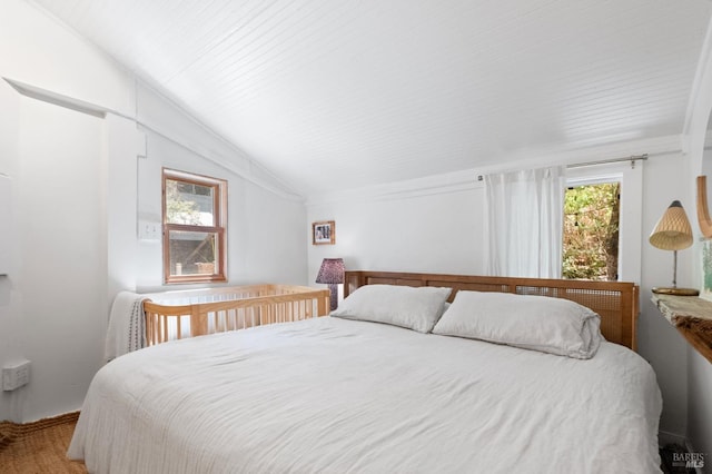 bedroom with lofted ceiling