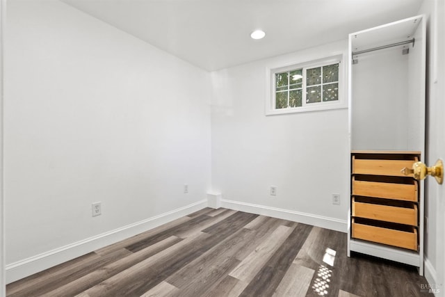 spare room featuring dark hardwood / wood-style floors