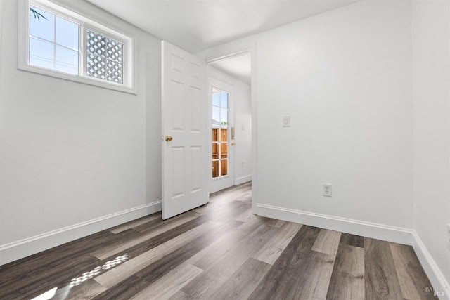 empty room with wood-type flooring