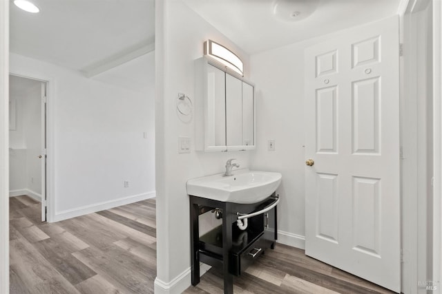 bathroom featuring hardwood / wood-style floors and vanity