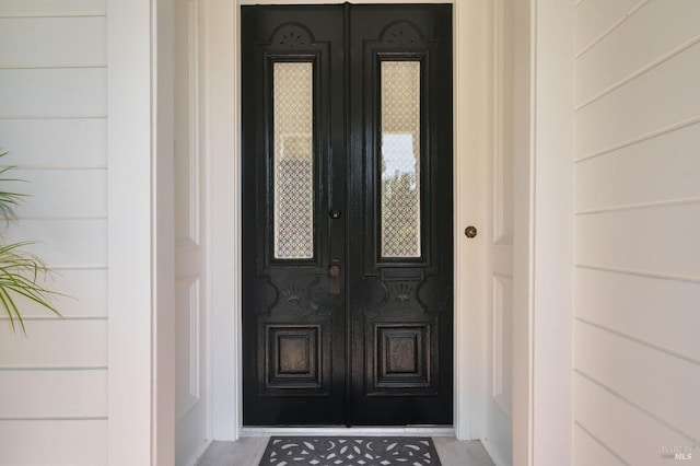 doorway to property featuring french doors