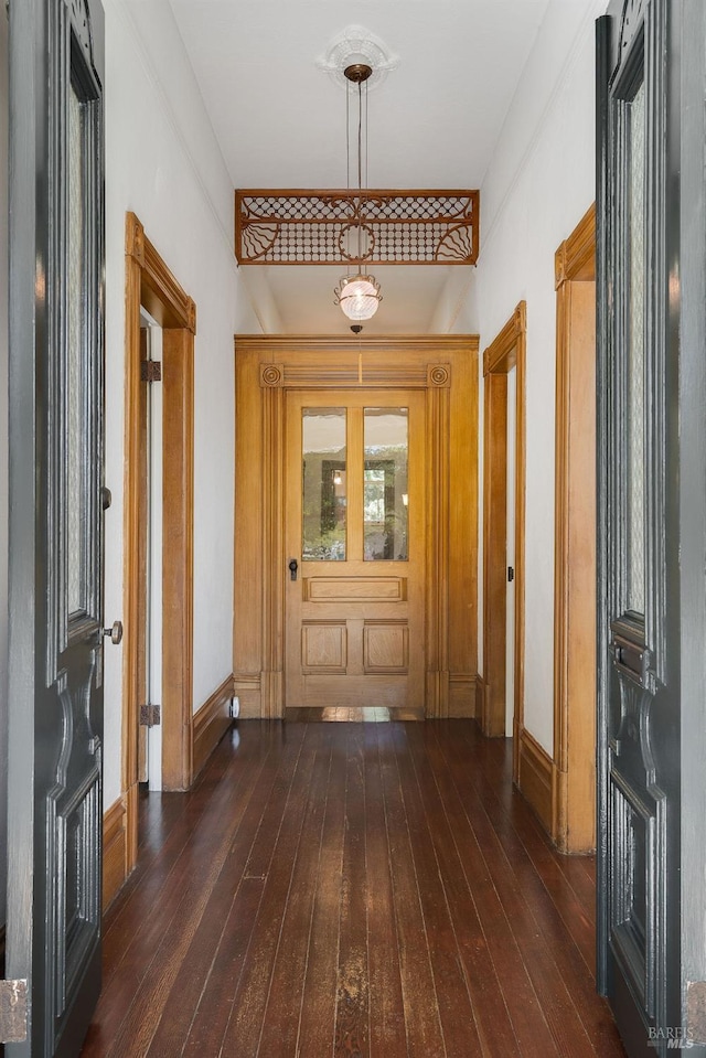 foyer with dark hardwood / wood-style flooring