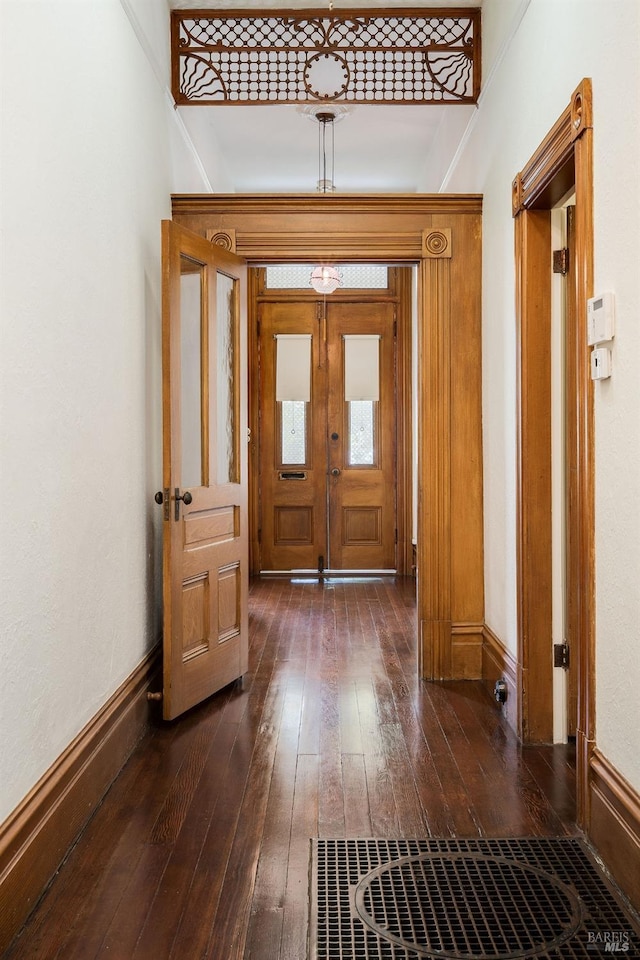 foyer featuring french doors and dark hardwood / wood-style flooring