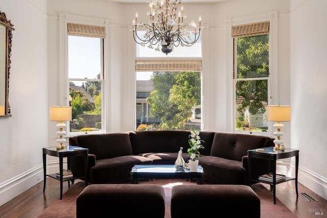 2230 1st St, Napa, CA 94559 - interior space featuring baseboards, a chandelier, wood finished floors, and visible vents