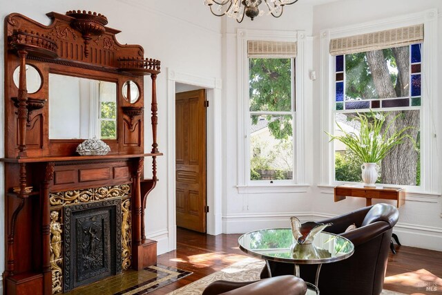 2230 1st St, Napa, CA 94559 - sitting room with an inviting chandelier, a fireplace with flush hearth, and wood finished floors