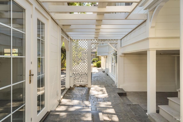 view of patio with a pergola and french doors