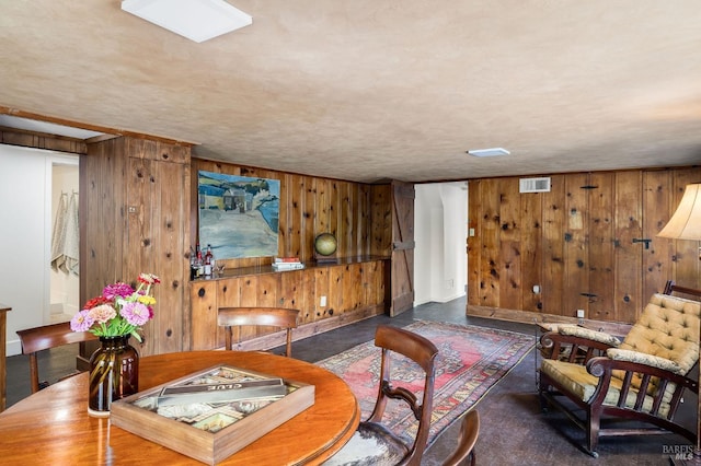 living room with wooden walls