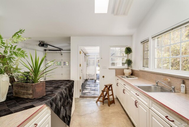 2230 1st St, Napa, CA 94559 - kitchen featuring a sink, white cabinetry, and light countertops