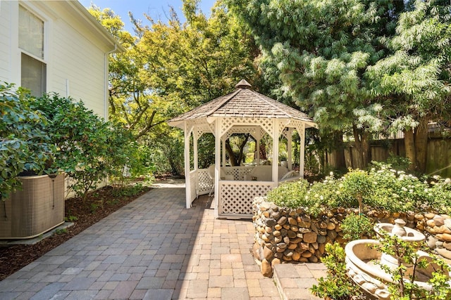 view of patio / terrace with central AC and a gazebo