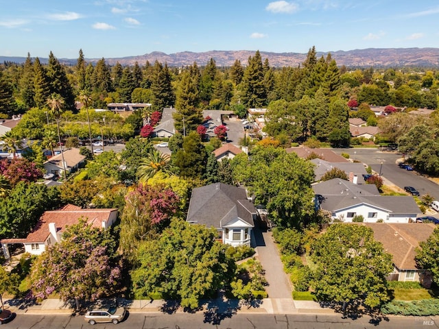 birds eye view of property with a mountain view