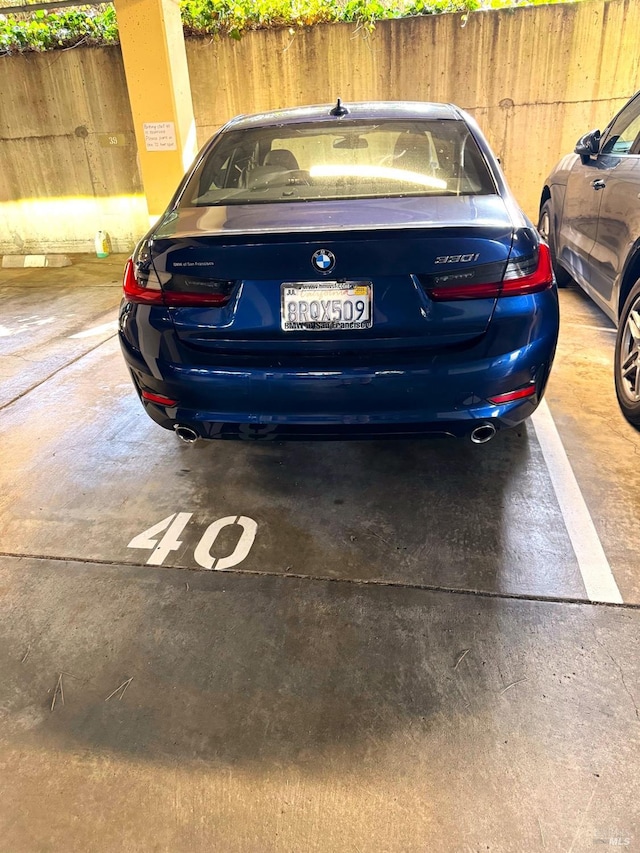 view of parking / parking lot with fence