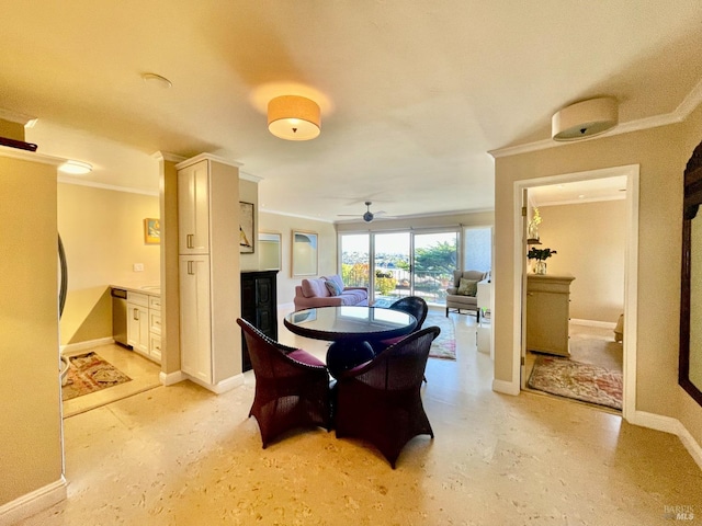 dining space with ornamental molding and ceiling fan