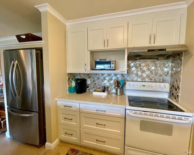 kitchen featuring electric stove, freestanding refrigerator, light countertops, under cabinet range hood, and backsplash