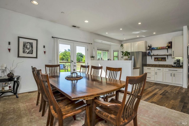 dining space with french doors and dark hardwood / wood-style floors