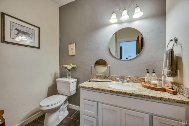 bathroom featuring vanity, toilet, and tile patterned floors