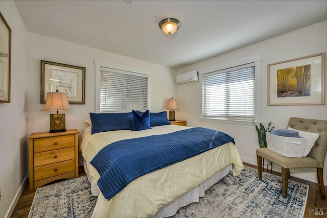 bedroom with wood-type flooring and a wall mounted AC