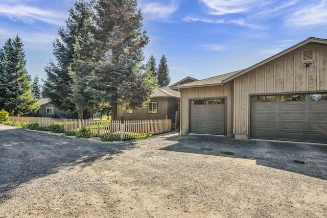 ranch-style house featuring a garage